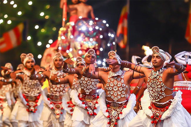 Traditional dances of Sri Lanka showing Kandyan Wes dancers in ceremonial silver regalia