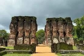 The towering Rankot Vihara brick stupa standing high amidst the forest in Polonnaruwa.