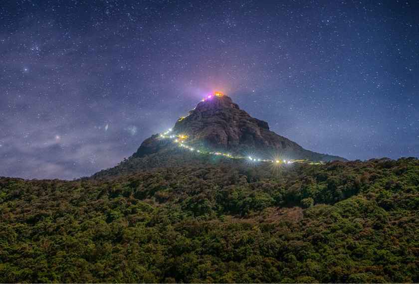 Illuminated steps on the night trail to Adam's Peak summit