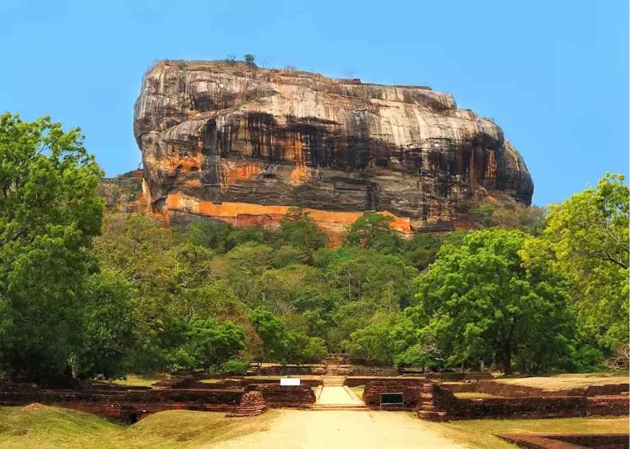Best time to travel to Sri Lanka - Sigiriya Rock fortress standing under clear blue skies