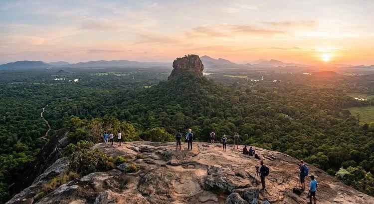 Scenic sunrise view from the summit of Pidurangala Rock overlooking Sigiriya fortress
