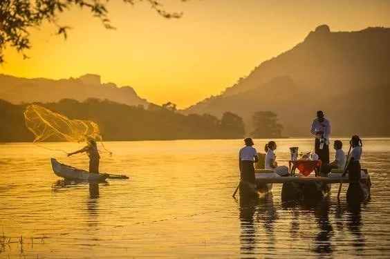 Hot air balloon ride in Sri Lanka floating above Kandalama Lake at sunrise near Sigiriya