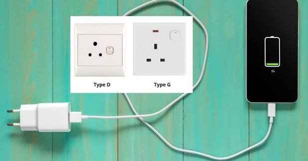 Universal electrical adapters in Sri Lanka plugged into a hotel wall socket