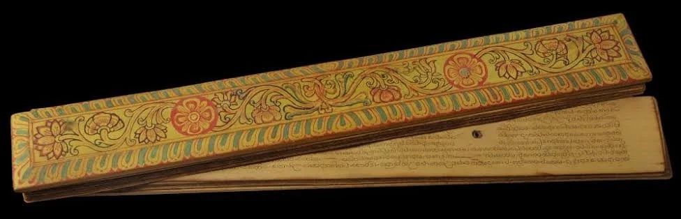 Ancient palm leaf manuscript and circular script preserved in Sri Lanka.