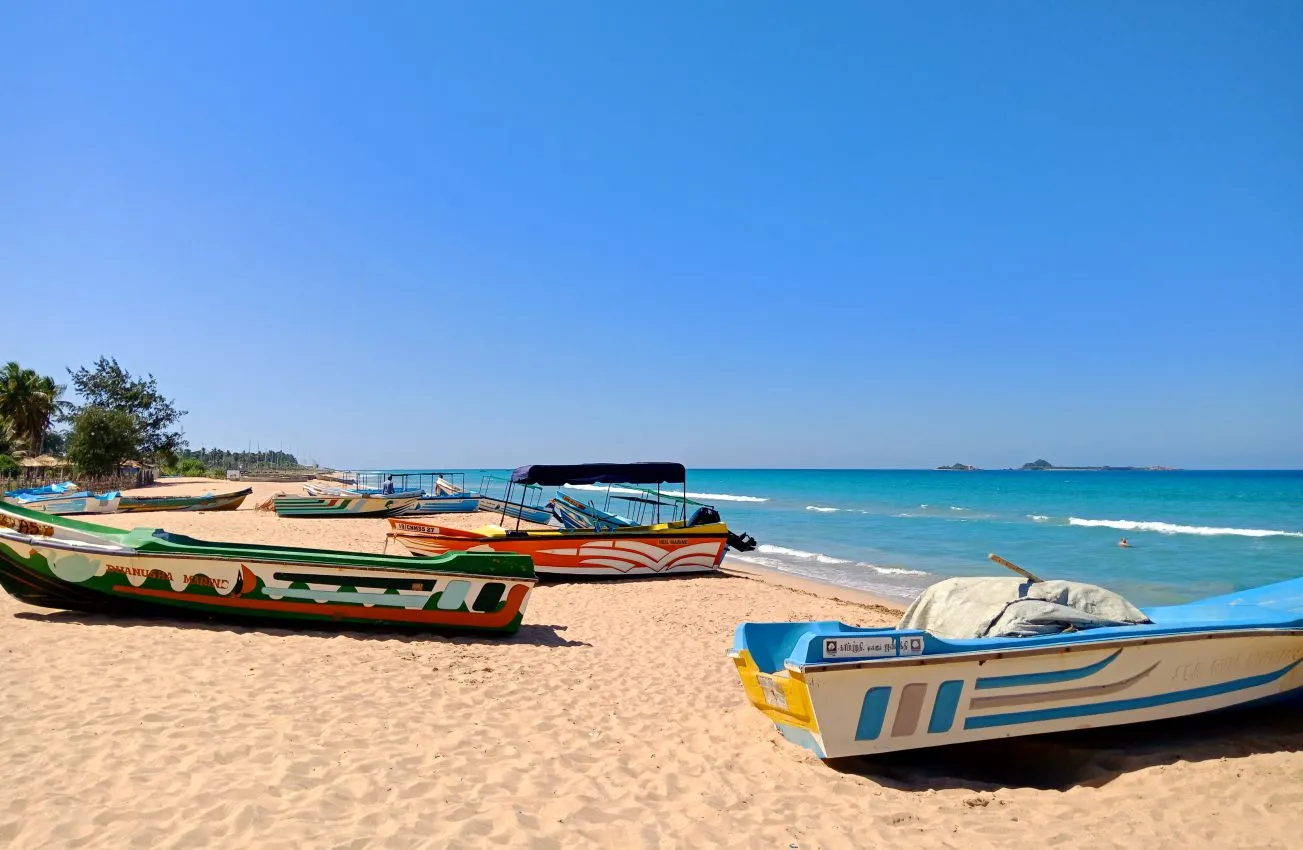 Boat anchored off the shores of Nilaveli Beach heading towards Pigeon Island Marine National Park.