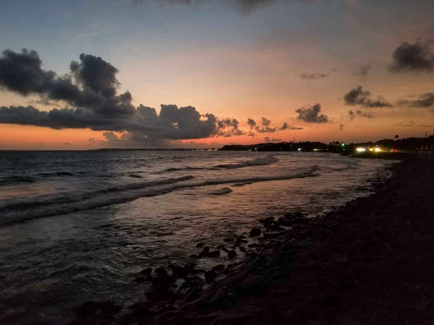 Breathtaking golden hour sunset over Matara coastal waters with dramatic clouds and glowing evening sky